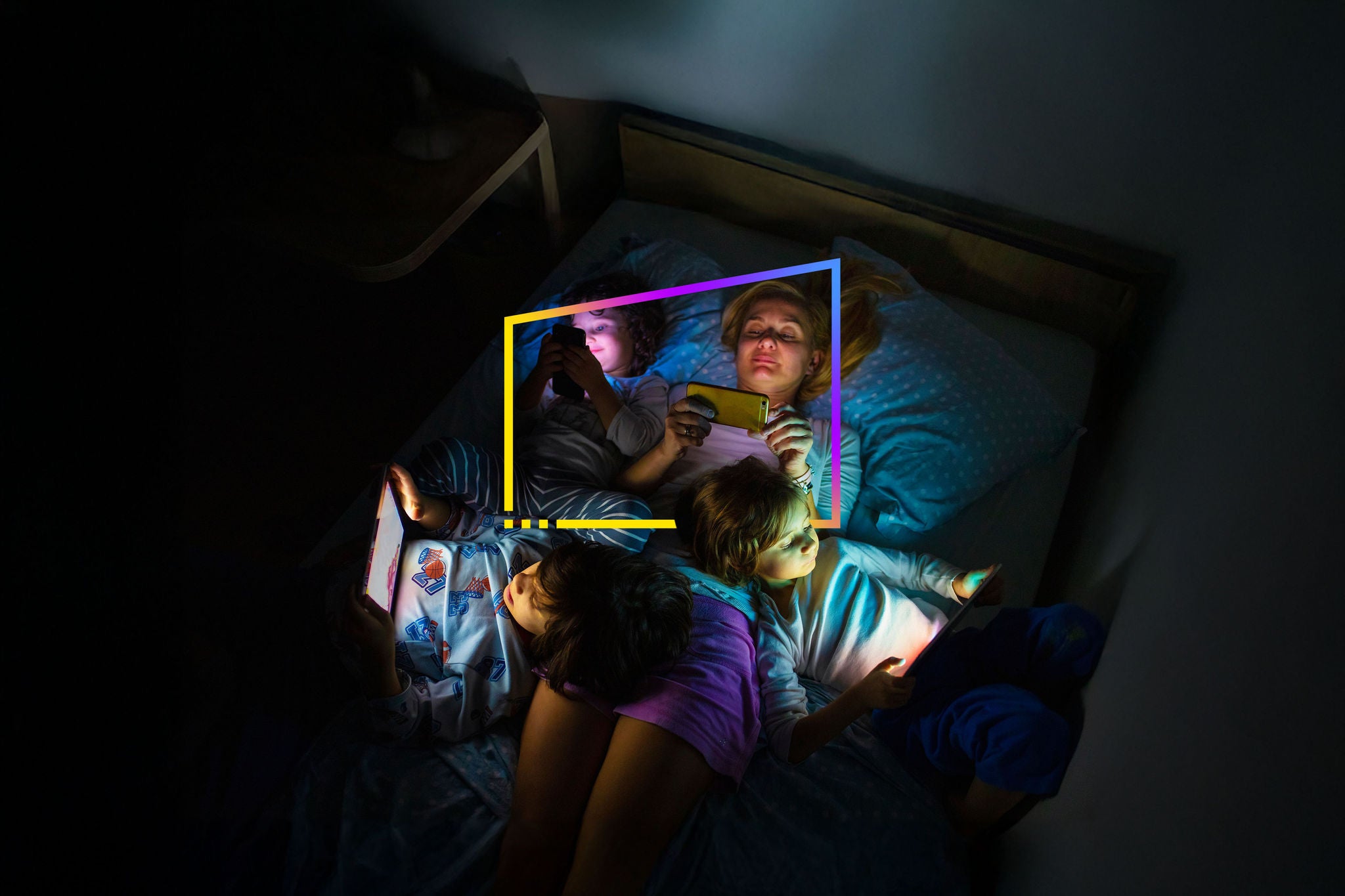 Mother with her kids looking at tablet
